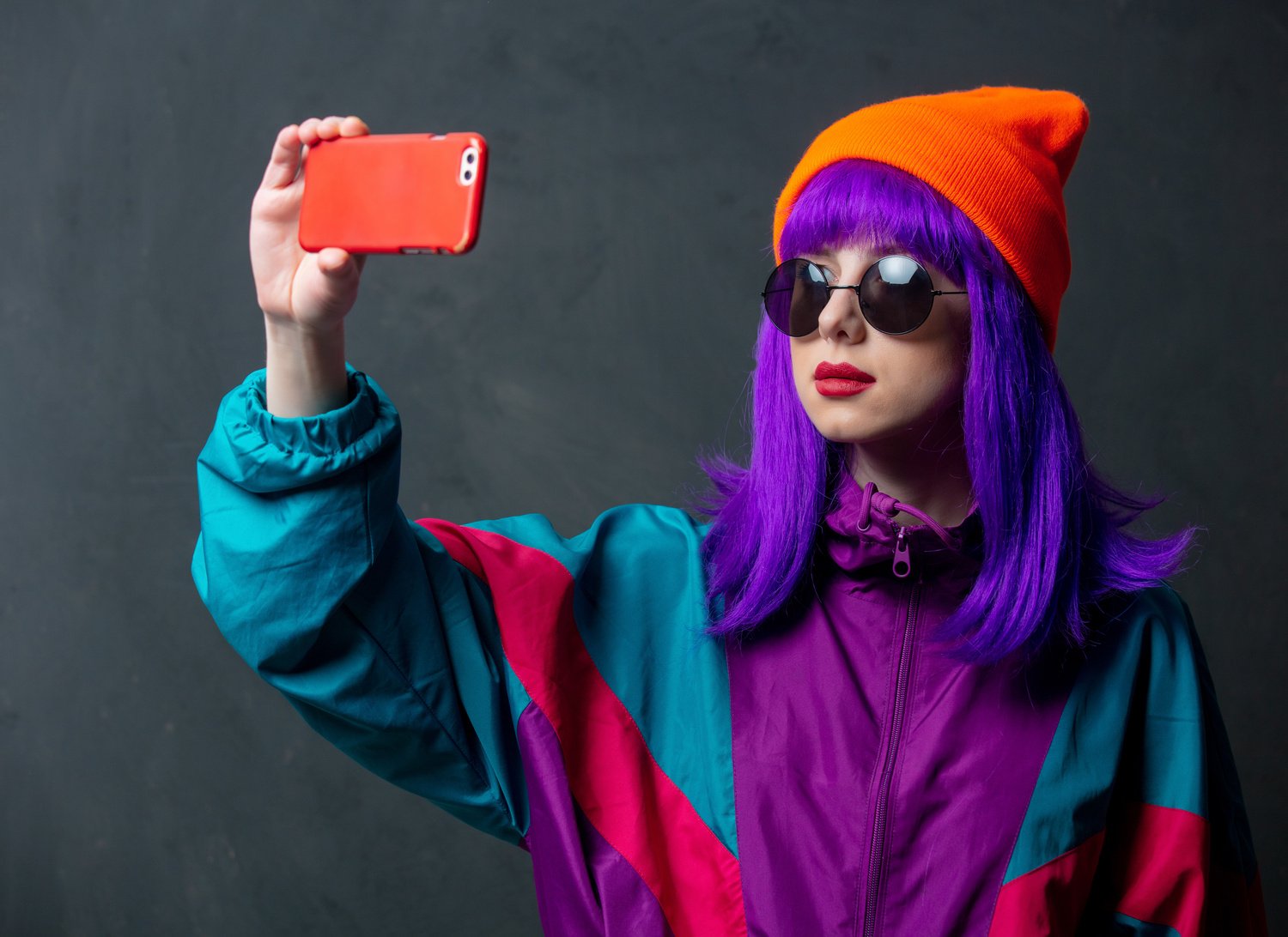 Style Woman in Sport Suit and Sunglasses Using Mobile Phone 